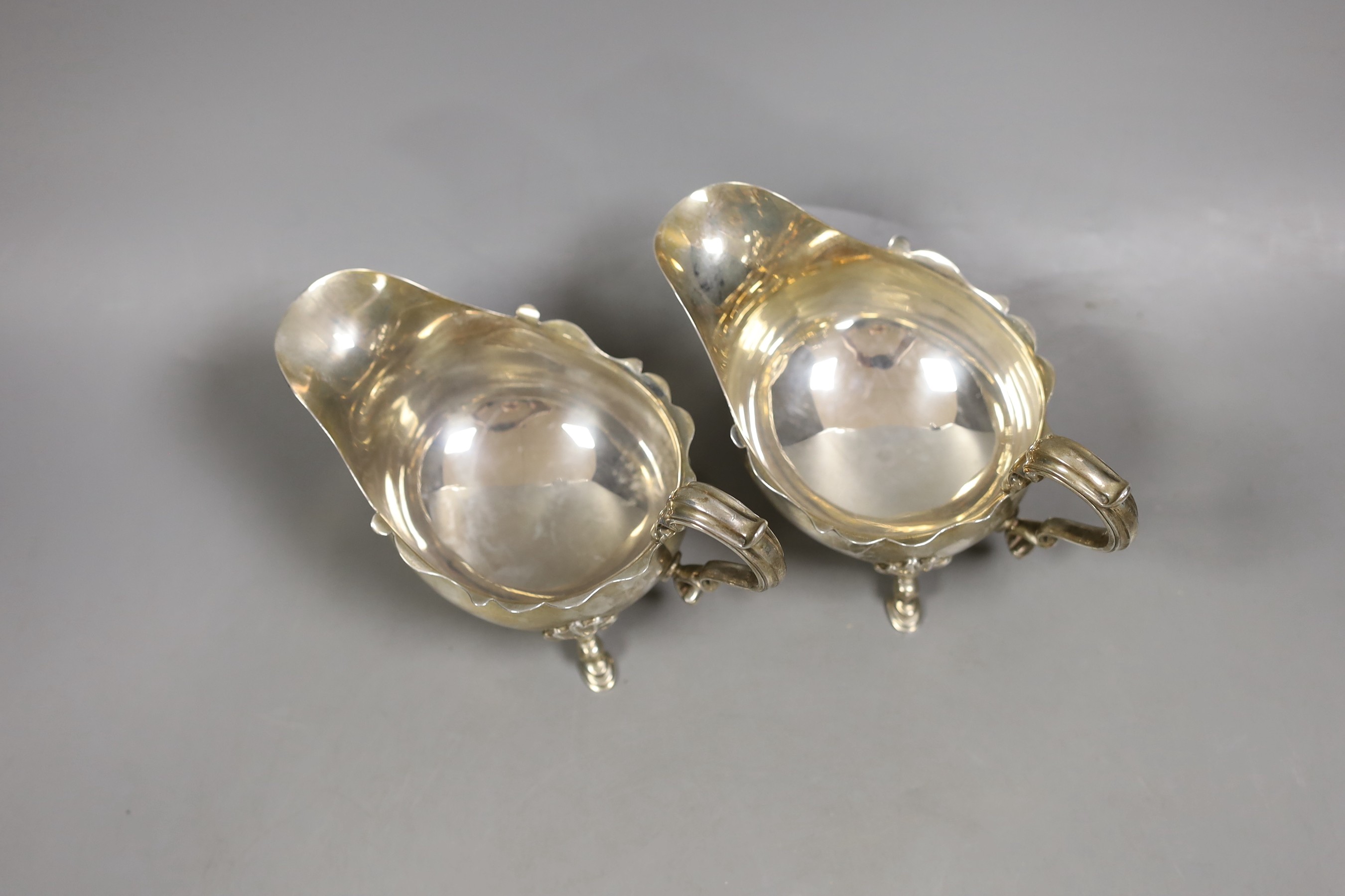 A pair of George V silver sauceboats, P.G. Dodd & Son, London, 1927, 15oz.